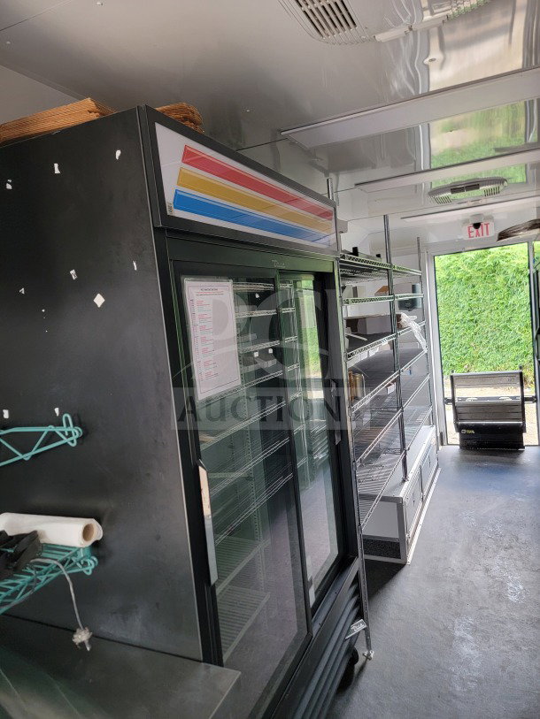 2021 SDG 8.5' x 20' tandem-axle mobile trailer interior with merchandisers, freezers, POS workstation; clean condition.