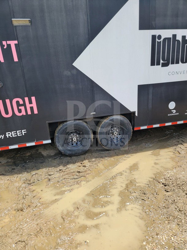 2021 SDG Tandem-Axle Mobile Fulfillment Trailer, Model 20, 8.5' x 20', 14,000 LB GVWR, exterior view, black with branding.