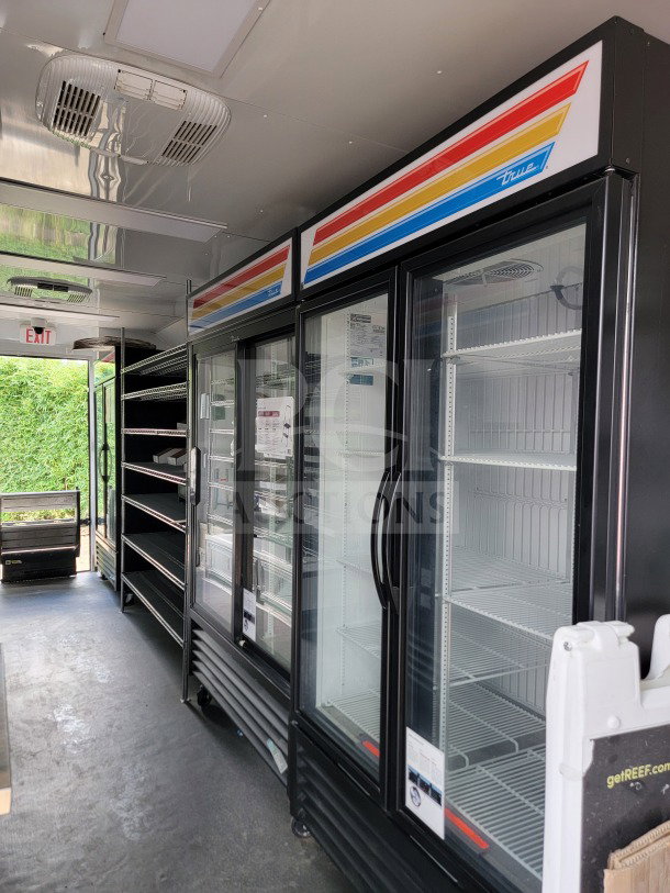 2021 SDG 8.5' x 20' mobile trailer with True merchandisers, freezers, tandem axle, and POS workstation. Excellent condition.