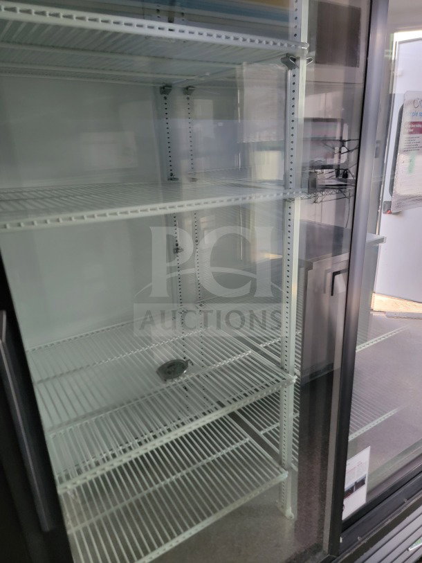 2021 SDG 8.5' x 20' mobile trailer interior with empty merchandising shelves and POS workstation.