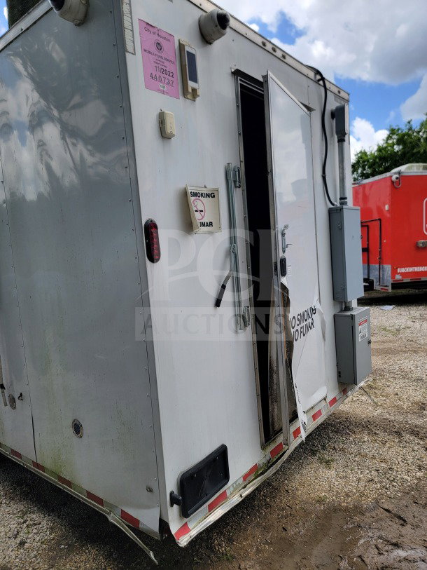 2021 Diamond Cargo 8.5' x 24' tandem-axle mobile kitchen trailer, visible wear, City of Houston permit, no smoking sign.