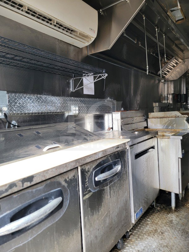 2021 Diamond Cargo mobile kitchen trailer interior showing NAKS hood, Pitco fryers, True & Turbo Air refrigeration.