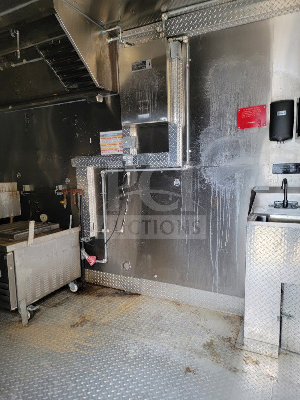 2021 Diamond Cargo 8.5' x 24' mobile kitchen trailer interior with NAKS hood, Pitco fryers, and Turbo Air refrigeration.