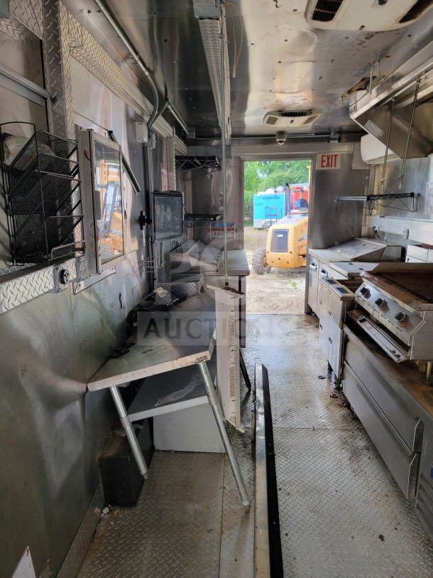 Diamond Cargo 8.5' x 24' mobile kitchen trailer interior with NAKS hood, Pitco fryers, True & Turbo Air refrigeration.