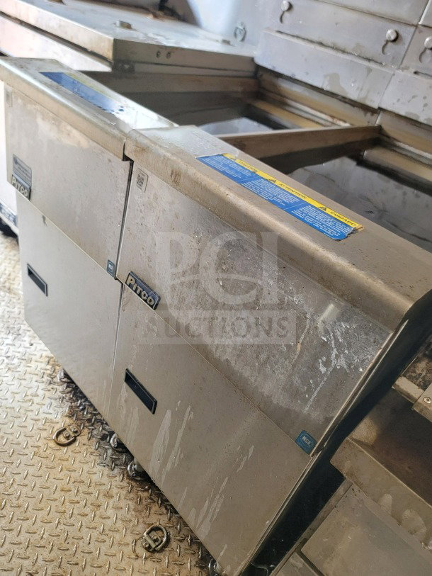 2021 Diamond Cargo 8.5' x 24' mobile kitchen trailer interior, featuring Pitco fryers on a metal floor.