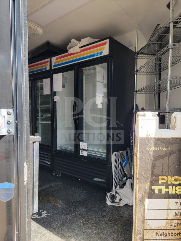 2021 SDG 8.5' x 20' mobile kitchen trailer interior with True refrigeration unit, CaptiveAire hood, shelving, dual-axle.