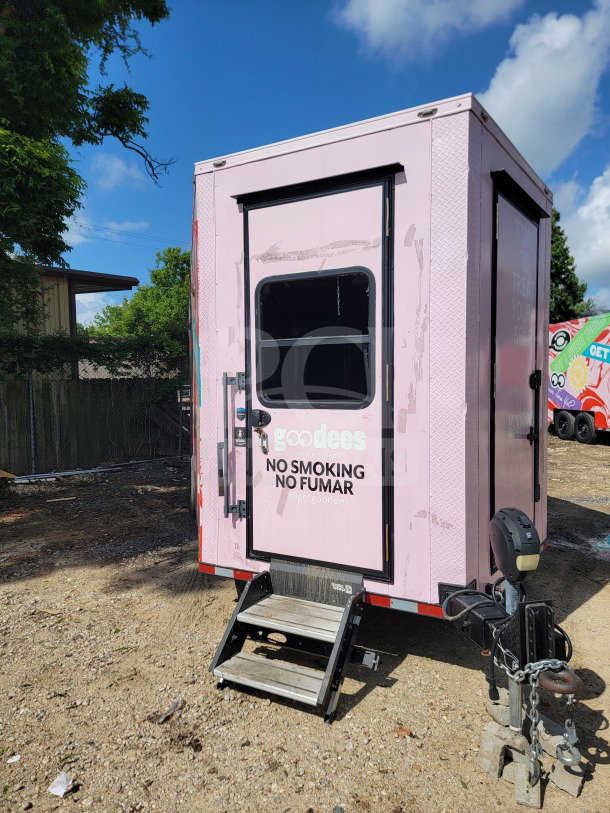 2021 SDG 8.5' x 20' double-axle trailer in pink, featuring cold storage, "no smoking" sign, steps, and hitch.