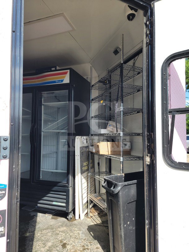SDG model 20 mobile infrastructure trailer with True refrigeration suite, shelving units, and logistics setup.