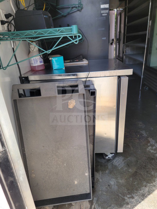 Interior of a 2021 SDG 8.5' x 20' trailer featuring a True Refrigeration unit, metal counter, and electrical setup.