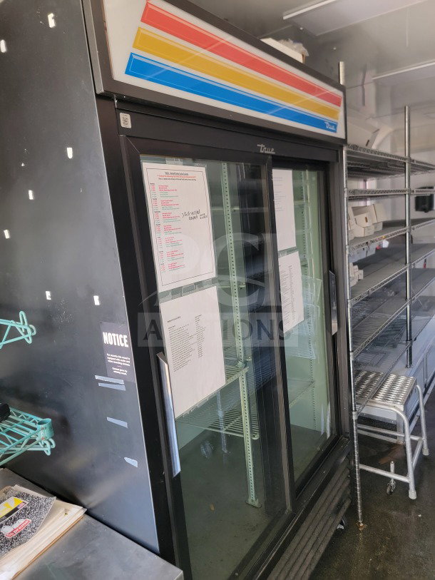 2021 SDG 8.5' x 20' trailer interior with True Refrigeration suite, shelving, and cold-storage unit; shelving visible.