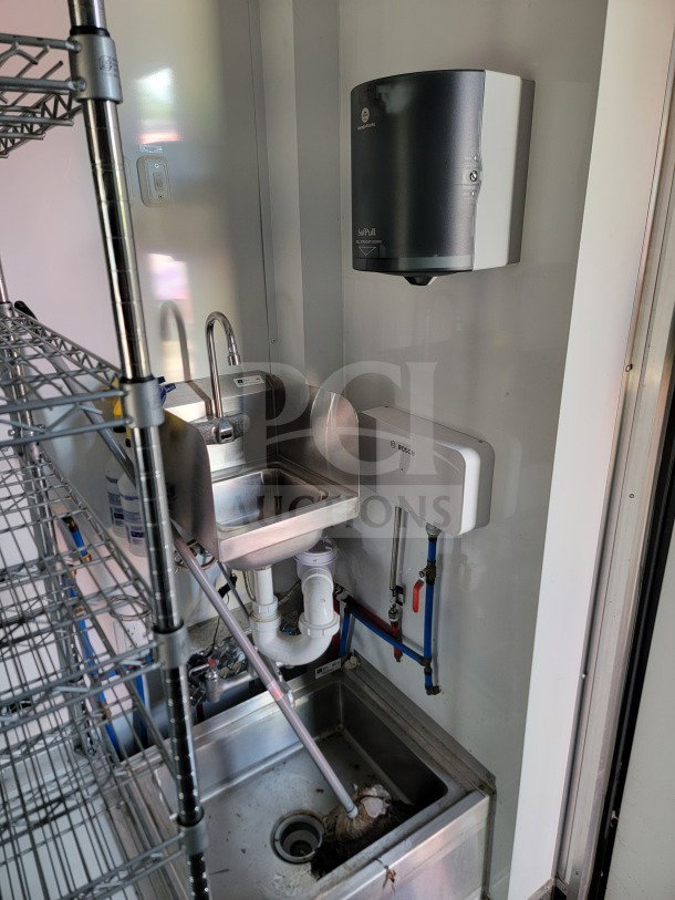 2021 SDG 8.5' x 20' trailer interior with sink, handwashing station, shelving. Commercial cold-storage features shown.