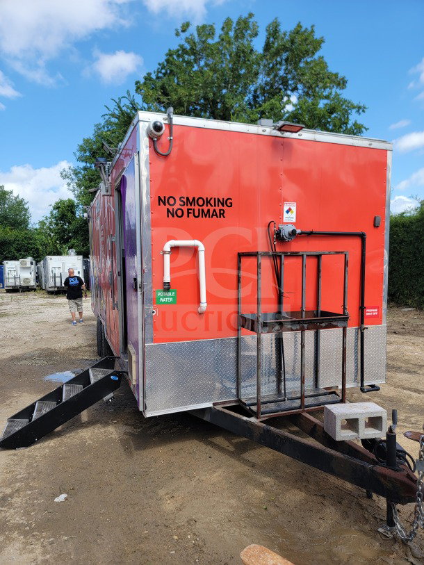 2021 Rock Solid Cargo 8.5' x 24' mobile kitchen trailer. Features CaptiveAire hood, True & Hoshizaki refrigeration. Red exterior.