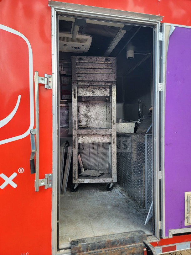 2021 Rock Solid Cargo 8.5' x 24' mobile kitchen trailer interior view, featuring shelving, equipment, and utility access.