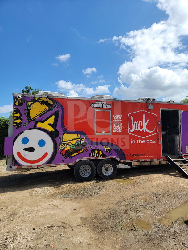 2021 Rock Solid Cargo 8.5' x 24' dual-axle mobile kitchen trailer with vibrant graphics, equipped with CaptiveAire hood.