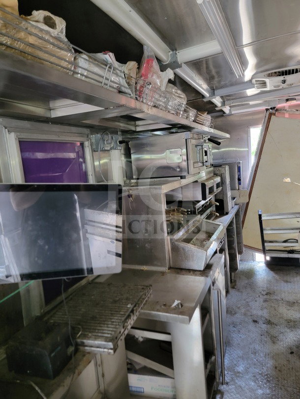 2021 Rock Solid 8.5' x 24' dual-axle mobile kitchen trailer, equipped with CaptiveAire hood and commercial appliances.