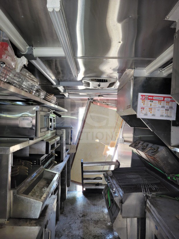 2021 Rock Solid Cargo 8.5' x 24' mobile kitchen trailer interior, featuring CaptiveAire hood, True, and Hoshizaki refrigeration equipment.
