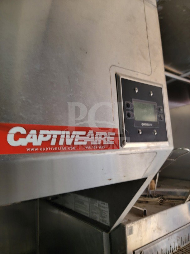 CaptiveAire hood system in 2021 Rock Solid Cargo mobile kitchen trailer, showcasing control panel and logo.