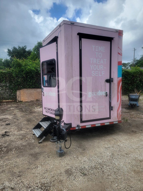 2021 SDG 8.5' x 20' dual-axle trailer with custom cold-chain storage, glass-door refrigeration, pink exterior, visible branding.
