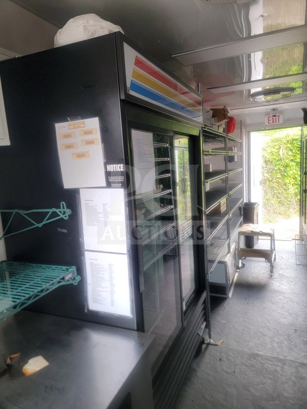 2021 SDG 8.5' x 20' dual-axle trailer with True glass-door refrigeration, custom cold-chain storage, and shelving.