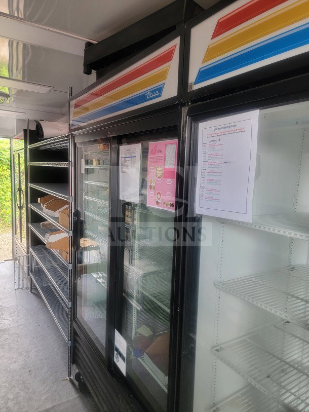 2021 SDG 8.5' x 20' dual-axle trailer with True glass-door refrigeration. Includes shelves, cold-chain storage. Model 20.