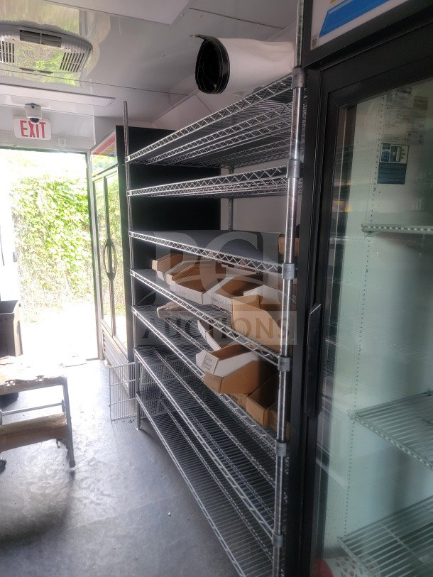 2021 SDG 8.5' x 20' dual-axle mobile trailer with cold-chain storage, shelving, and True glass-door refrigeration.