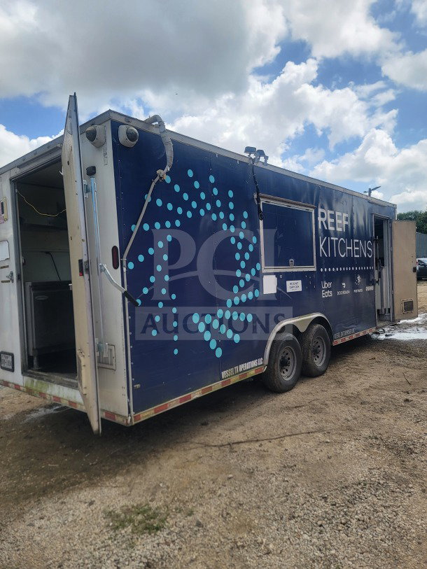 2021 Rock Solid Cargo 8.5' x 24' dual-axle mobile kitchen trailer, branded "REEF Kitchens," in good condition.