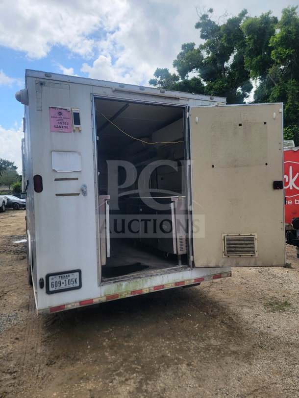 2021 Rock Solid Cargo 8.5' x 24' mobile ghost kitchen trailer, dual-axle, open rear, visible refrigeration units, fair condition.