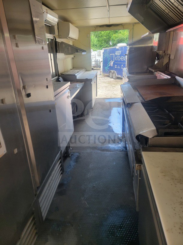 2021 Rock Solid Cargo 8.5' x 24' mobile ghost kitchen trailer interior, featuring Serv-Ware refrigeration and American Range fry line.