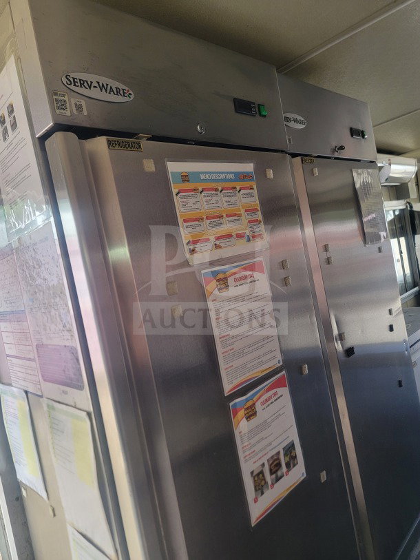 2021 Rock Solid Cargo trailer interior featuring Serv-Ware refrigeration units with menu information displayed.