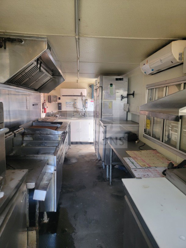 2021 Rock Solid Cargo 8.5' x 24' mobile kitchen trailer interior with Serv-Ware refrigeration and American Range fry line.