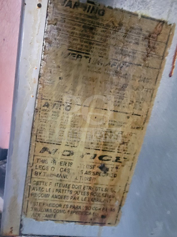 Worn label on LOT #7 2021 Rock Solid Cargo Mobile Ghost Kitchen Trailer, indicating usage instructions and specifications.