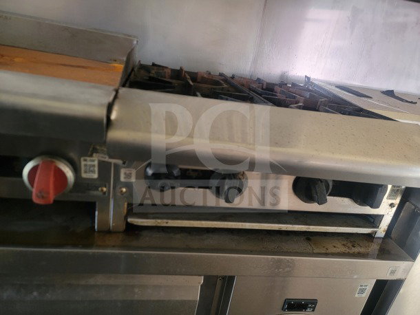 2021 Rock Solid Cargo mobile kitchen trailer interior with American Range fry line and Serv-Ware refrigeration.