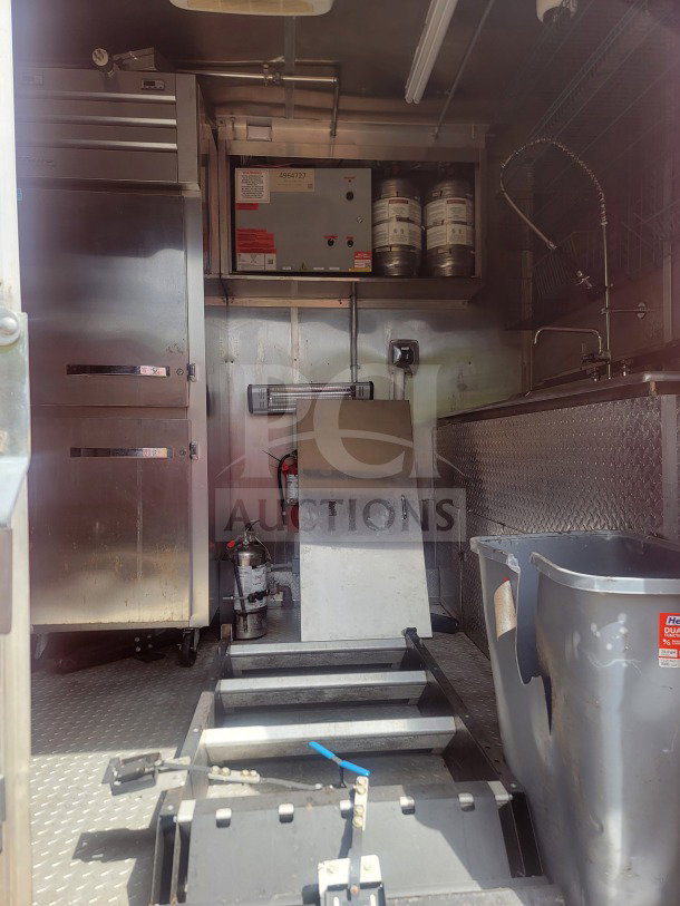 2021 Titanium Cargo 8.5' x 24' mobile QSR kitchen trailer interior. Features True and Randell refrigeration, CaptiveAire ventilation.