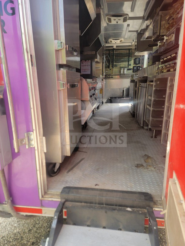 2021 Titanium Cargo 8.5' x 24' QSR kitchen trailer interior with CaptiveAire ventilation, True & Randell units, dual-axle.