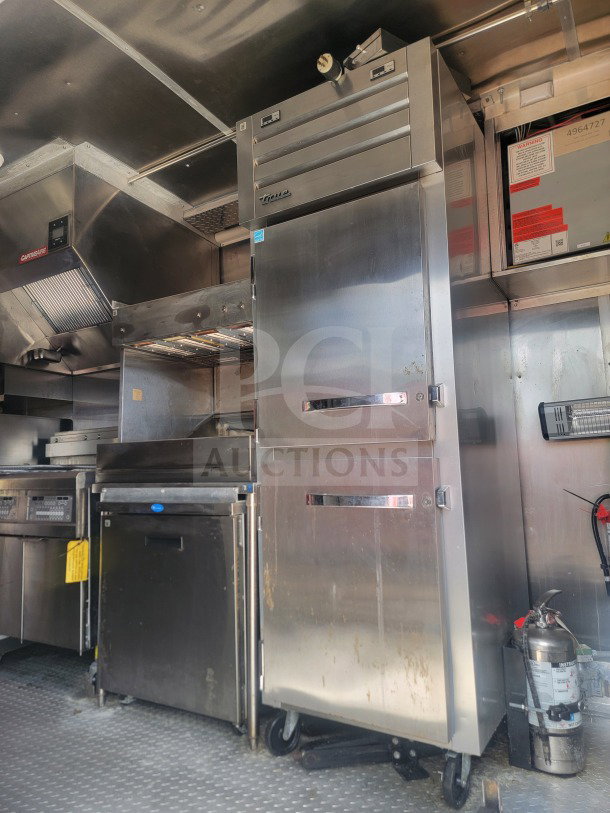 2021 Titanium Cargo 8.5' x 24' QSR Kitchen Trailer interior with CaptiveAire ventilation, True refrigeration unit.