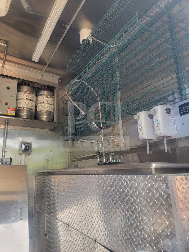 2021 Titanium Cargo 8.5' x 24' Mobile QSR Kitchen Trailer with dual sinks, CaptiveAire ventilation, and storage. Model 24.