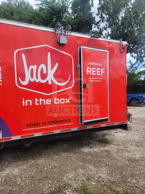 2021 Titanium Cargo 8.5' x 24' mobile QSR kitchen trailer, red, Jack in the Box branding, dual-axle, excellent condition.