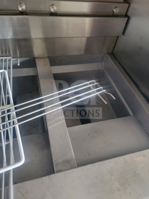 Interior view of 2021 Titanium Cargo 8.5' x 24' mobile QSR kitchen trailer with stainless steel surfaces.