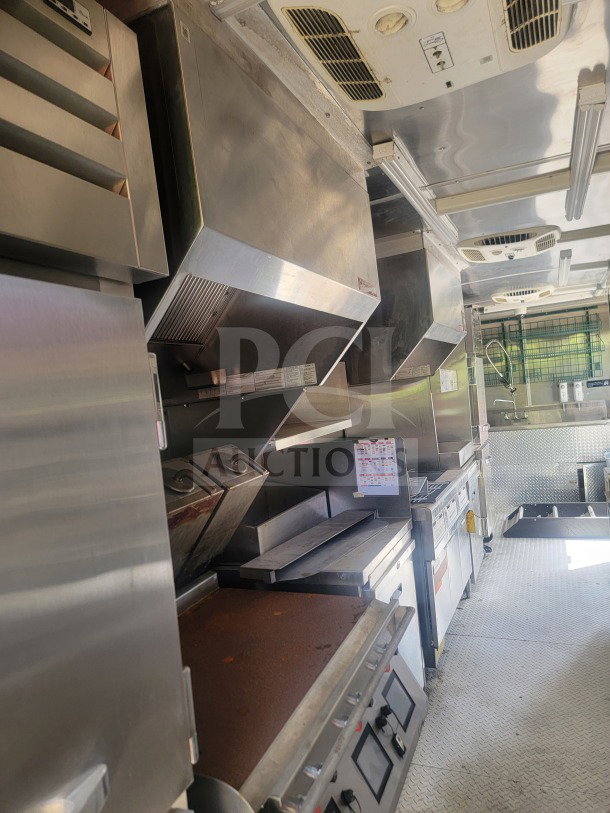 2021 Titanium Cargo 8.5' x 24' mobile kitchen trailer, dual-axle, equipped with CaptiveAire ventilation, True & Randell refrigeration.