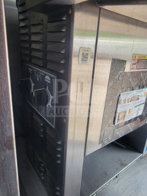 CaptiveAire ventilation unit detail in 2021 Titanium Cargo mobile kitchen trailer, showing control panel and caution labels.
