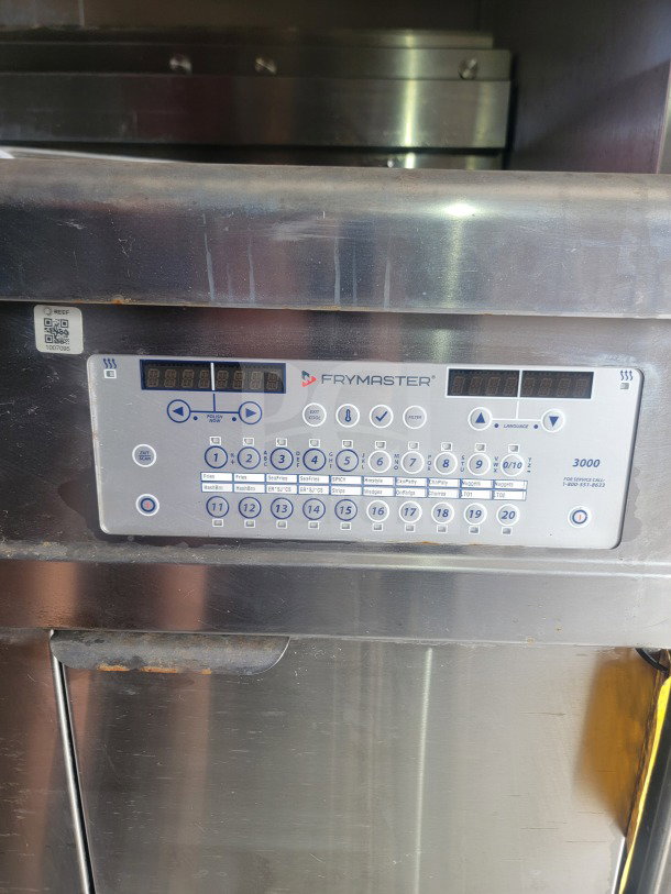 Frymaster control panel on 2021 Titanium Cargo mobile kitchen trailer, showing digital display and cooking preset buttons.