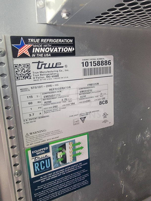 True Refrigeration label on 2021 Titanium Cargo QSR Kitchen Trailer, showing model STG1DT-2HS-HC details and RCU technology badge.