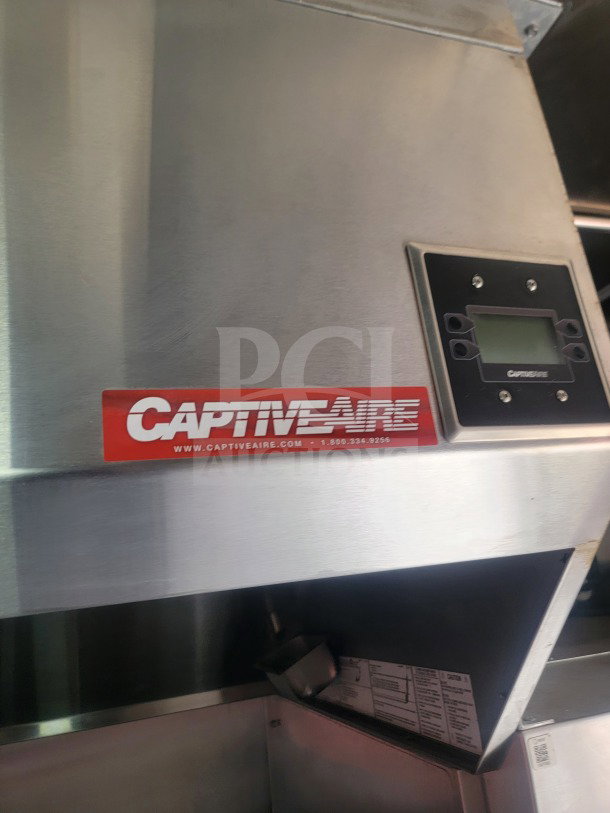 CaptiveAire ventilation system in 2021 Titanium Cargo mobile kitchen trailer, showing control panel and model label.
