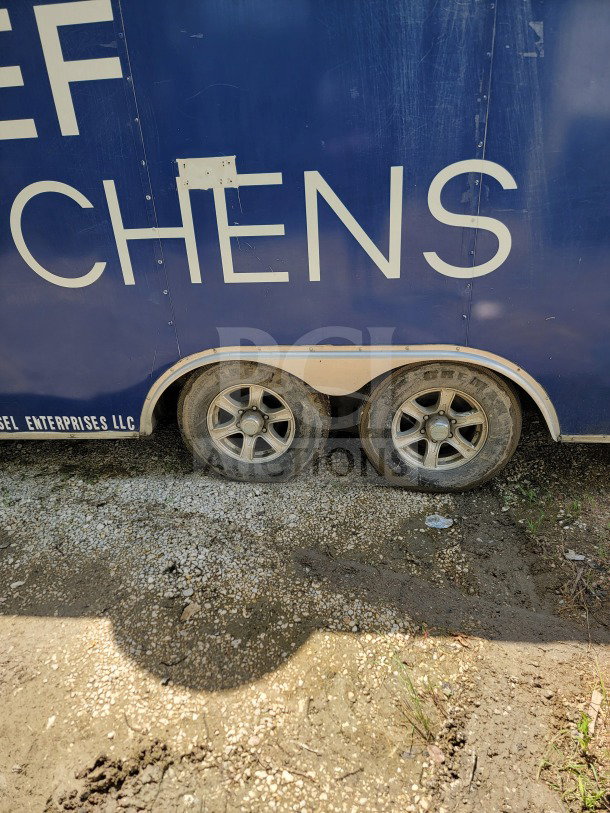 2019 Diamond Cargo 8.5' x 24' dual-axle mobile kitchen trailer, exterior view showing wear, wheels, and business signage.