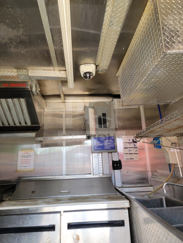2019 Diamond Cargo 8.5' x 24' mobile kitchen with Arctic Air storage and Wells cooking line. Interior view showing equipment and utilities.