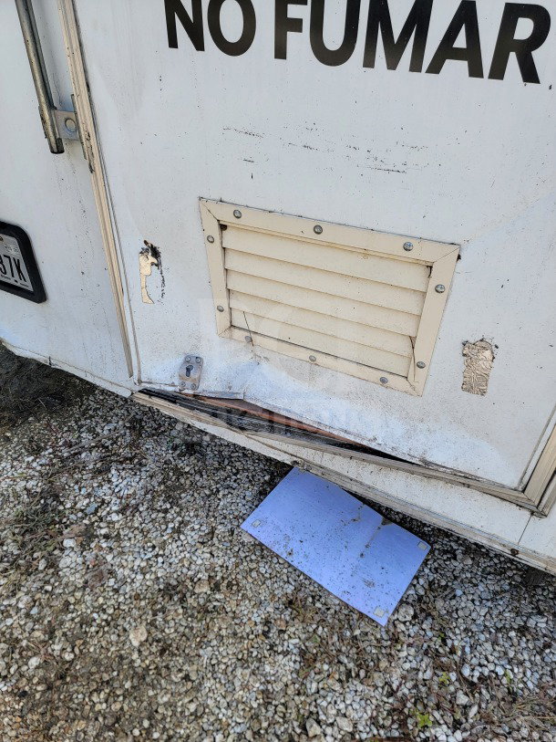 2019 Diamond Cargo 8.5' x 24' mobile kitchen trailer exterior, showing damage around vent, peeling paint, and "No Fumar" text.