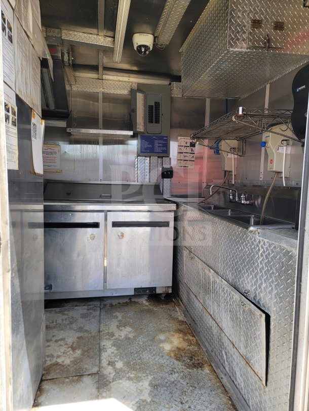 2019 Diamond Cargo 8.5' x 24' mobile kitchen trailer interior, featuring Arctic Air storage and Wells cooking line.