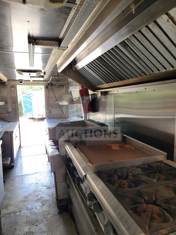 2019 Diamond Cargo 8.5' x 24' mobile kitchen trailer interior with Wells cooking line and Arctic Air storage, clean condition.