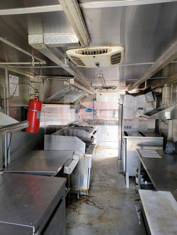 2019 Diamond Cargo 8.5' x 24' mobile kitchen trailer, features Arctic Air Storage and Wells cooking line, dual-axle, well-maintained.