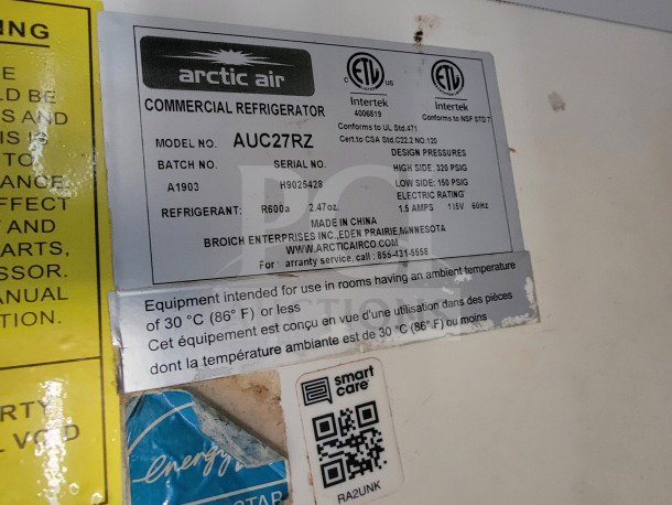 Label for Arctic Air Commercial Refrigerator Model AUC27RZ, showing design pressures, electrical rating, and warranty info.